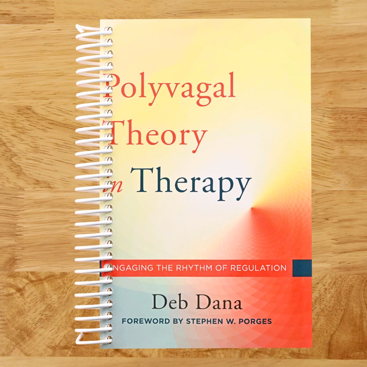 The Polyvagal Theory in Therapy: Engaging the Rhythm of Regulation (Norton Series on Interpersonal Neurobiology) (Spiral bound) Happy Coil spiral bound book