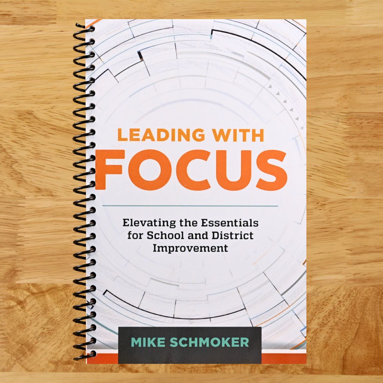 Leading with Focus: Elevating the Essentials for School and District Improvement (Spiral bound) Happy Coil spiral bound book