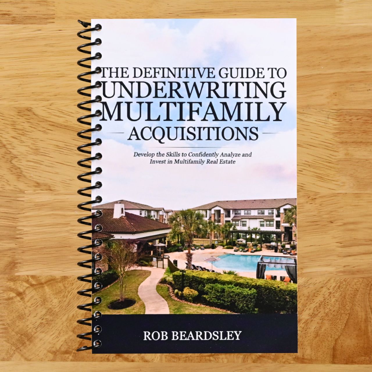 The Definitive Guide to Underwriting Multifamily Acquisitions: Develop the skills to confidently analyze and invest in multifamily real estate (Spiral bound) Happy Coil spiral bound book