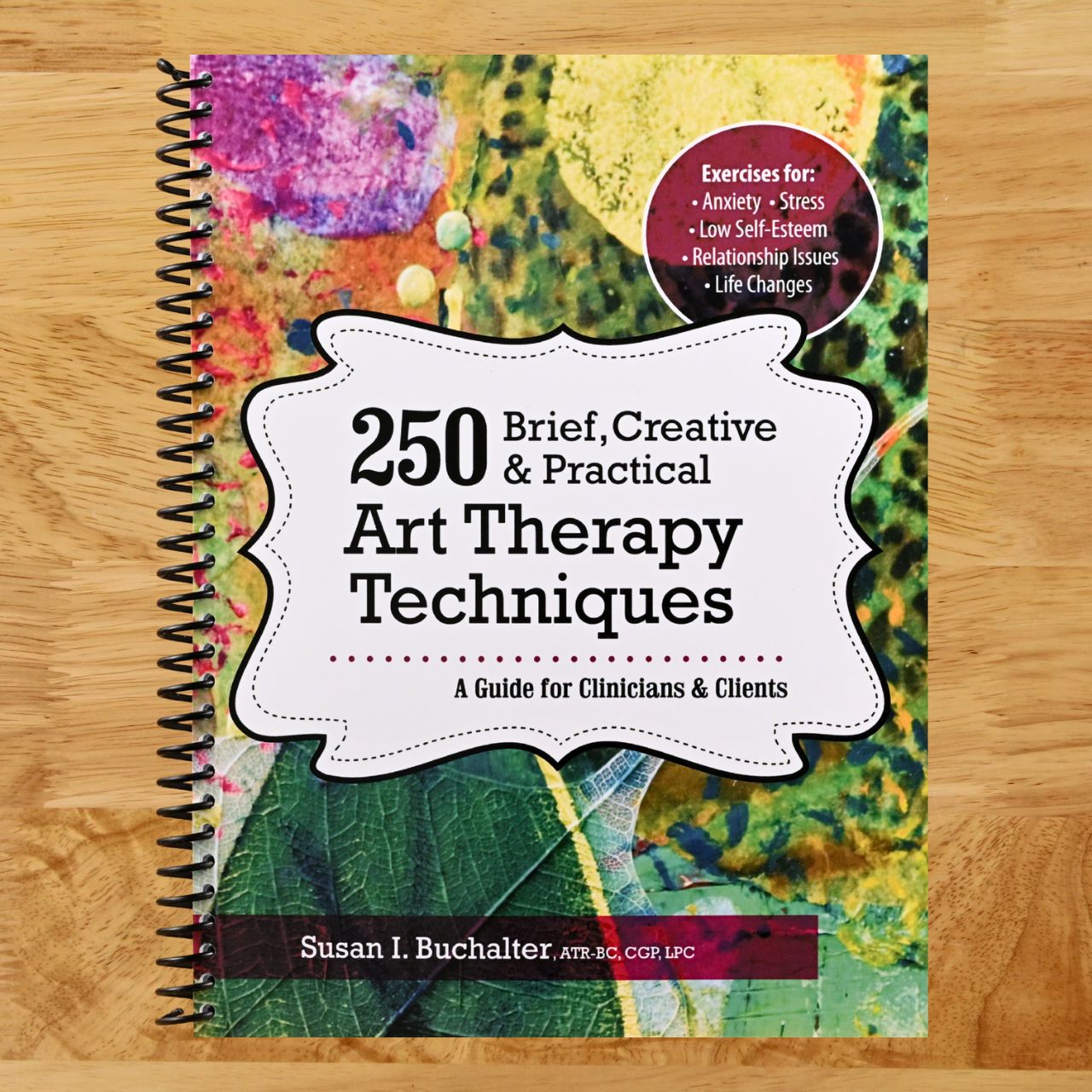 250 Brief, Creative & Practical Art Therapy Techniques: A Guide for Clinicians and Clients (Spiral bound) Happy Coil spiral bound book