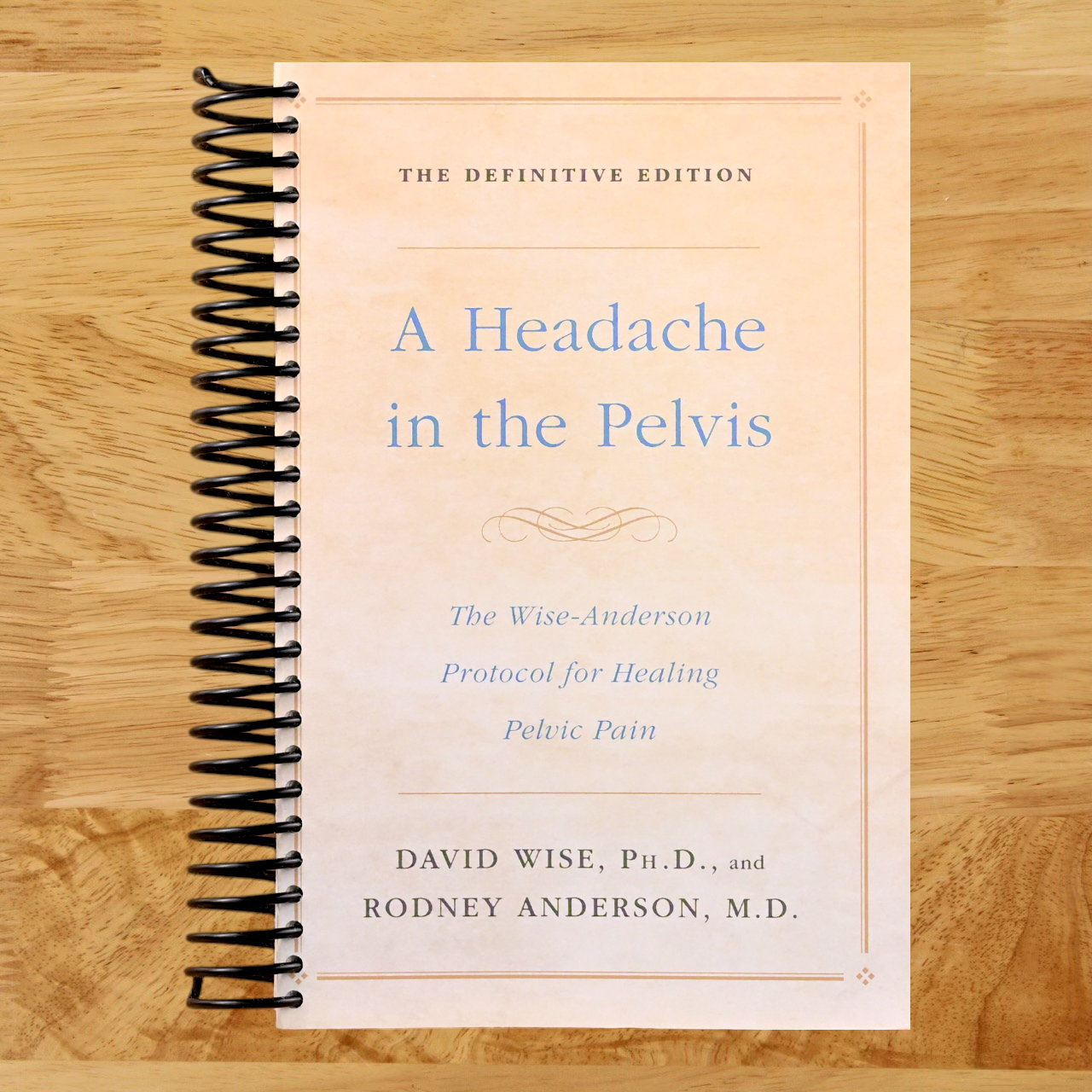 A Headache in the Pelvis: The Wise-Anderson Protocol for Healing Pelvic Pain: The Definitive Edition (Spiral bound) Happy Coil spiral bound book