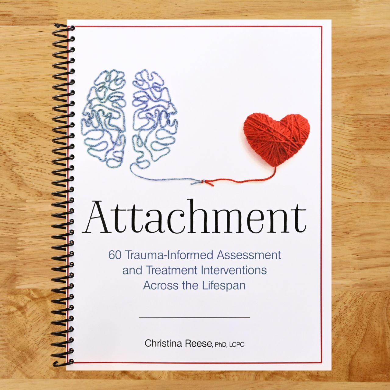 Attachment: 60 Trauma-Informed Assessment and Treatment Interventions Across the Lifespan (Spiral bound) Happy Coil spiral bound book