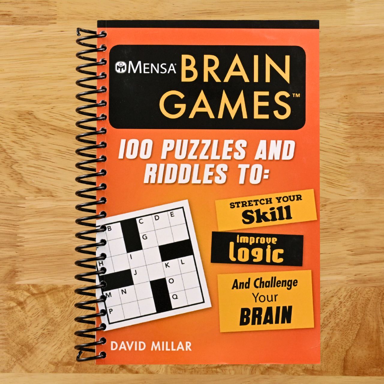 Mensa® Brain Games: 100 Puzzles and Riddles to Stretch Your Skill, Improve Logic, and Challenge Your Brain (Mensa® Brilliant Brain Workouts) (Spiral bound) Happy Coil spiral bound book