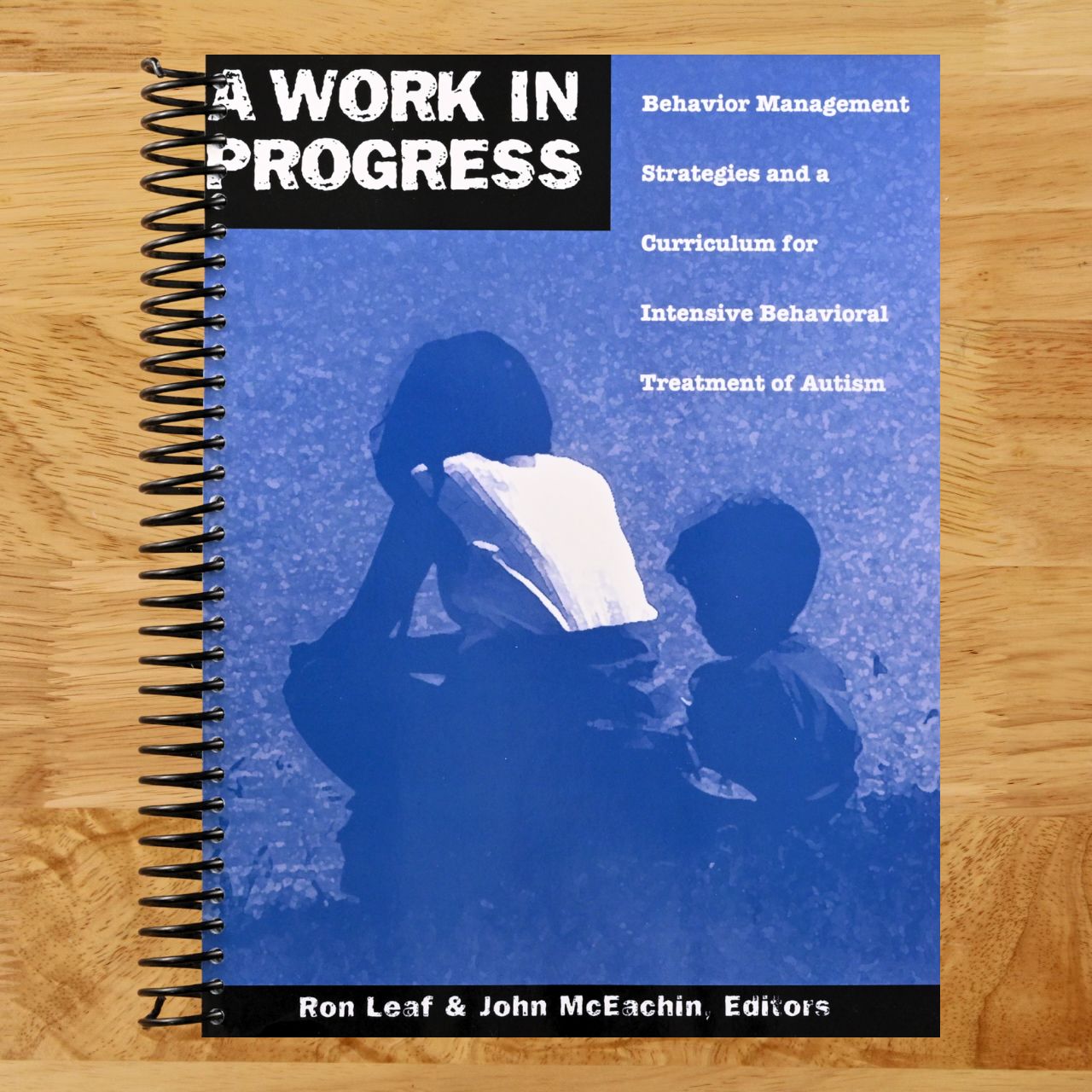 A Work in Progress: Behavior Management Strategies & A Curriculum for Intensive Behavioral Treatment of Autism (Spiral bound) Happy Coil spiral bound book