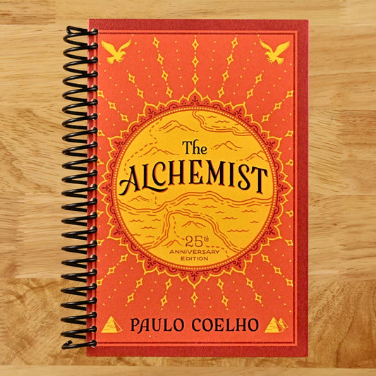 The Alchemist: A Modern Classic Fable of Spiritual Healing, Self-Discovery, and the Power of Dreams in a Visually Stunning Graphic Novel (Spiral bound) Happy Coil spiral bound book
