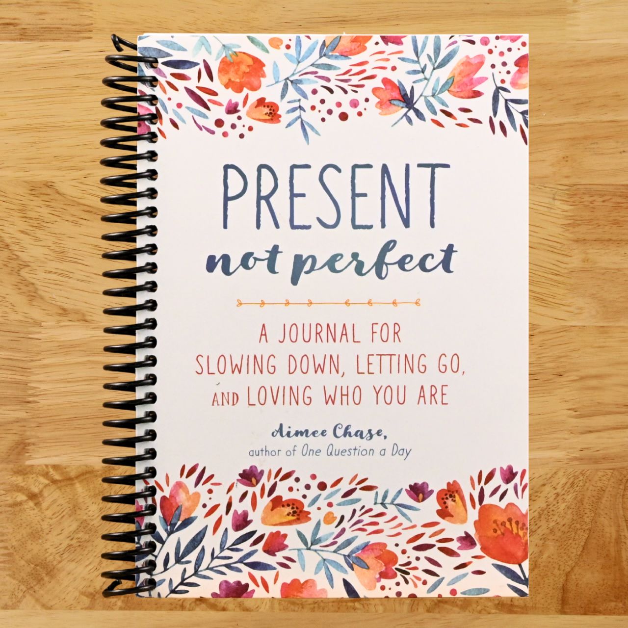 Present, Not Perfect: A Journal for Slowing Down, Letting Go, and Loving Who You Are (Spiral bound) Happy Coil spiral bound book