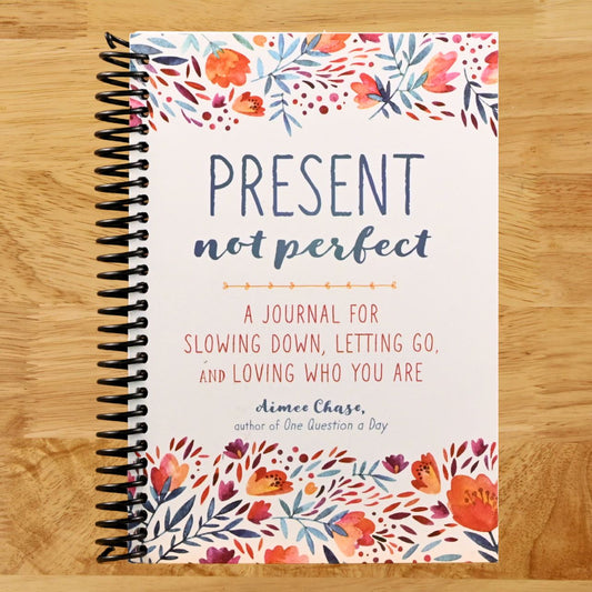 Present, Not Perfect: A Journal for Slowing Down, Letting Go, and Loving Who You Are (Spiral bound) Happy Coil spiral bound book